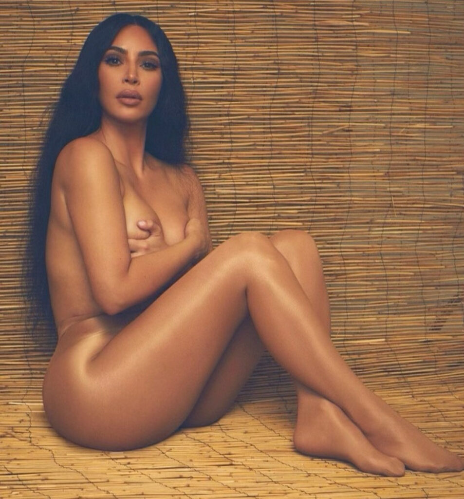Kim Kardashian displays boobs in nothing but flesh-coloured tights