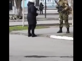 "What the f*** are you doing here?" Ukrainian woman attacks Russian soldier invading her country (video)